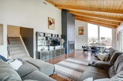 a living room with two couches and a table at Chic Santa Paula Home with Mountain and City Views! in Santa Paula