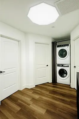 a laundry room with a washer and dryer at Bright Corner Home Retreat Near SoFi in Los Angeles