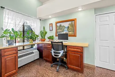 a home office with a desk with a computer on it at Howard Johnson by Wyndham Pasadena in Pasadena