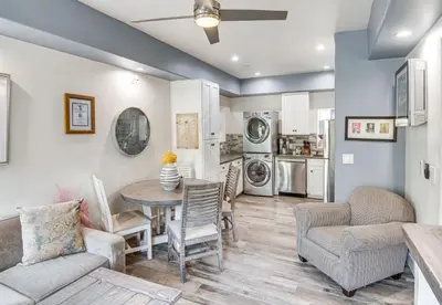a kitchen and living room with a table and chairs at The Creek Retreat - Totally private 1Br/1Bd in Newbury Park
