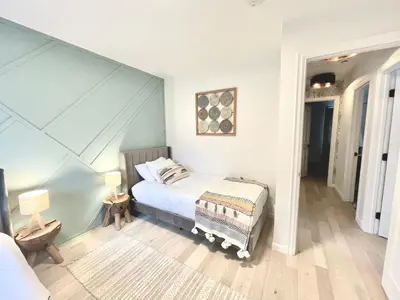 a bedroom with a bed in a room at NEW & Luxurious House, hot tub & amazing views in Lake Arrowhead