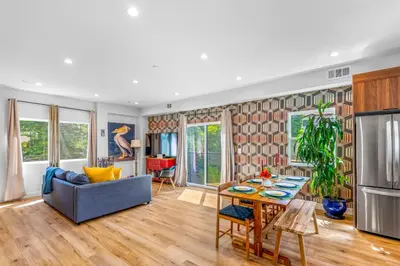 a living room with a table and a couch at Stylish Sherman Oaks Townhouse 3bed + 3.5bath All Master Suites in Los Angeles