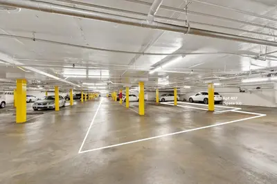 an empty parking garage with cars parked in it at Beverly Hills Penthouse 2 BR Apt with Parking 407 in Los Angeles