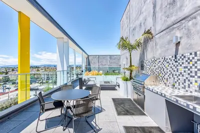 a patio with a table and chairs on a balcony at Culver City 1br w pool gym easy access to 405 LAX-1136 in Los Angeles