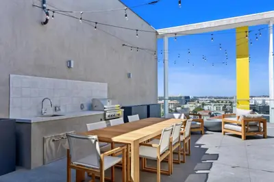 a kitchen and dining room with a wooden table and chairs at Culver City 1br w pool gym easy access to 405 LAX-1136 in Los Angeles