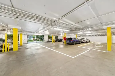 a large parking garage with cars parked in it at Beverly Hills 2 bed 2 bath Penthouse with Den and Parking 414 in Los Angeles