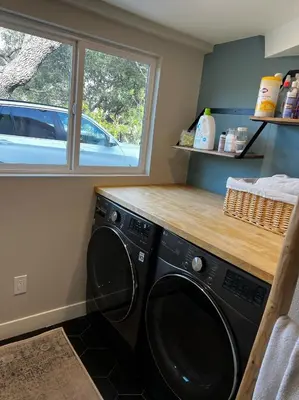a laundry room with a washing machine and a window at NEW Modern apt w/pool & hot tub in nature in Thousand Oaks