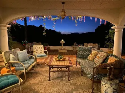 a patio with couches and a table with a view at Boho Chic Malibu Retreat Estate Salt Pool + Yoga in Malibu