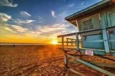 a shack on the beach at sunset at Boho Chic Malibu Retreat Estate Salt Pool + Yoga in Malibu