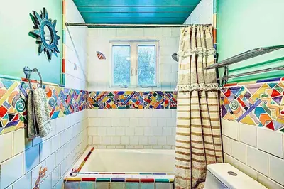 a bathroom with a tub and a shower curtain at Boho Chic Malibu Retreat Estate Salt Pool + Yoga in Malibu