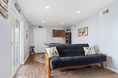 a living room with a blue couch in a room at Panoramic Views at Deer Crest Lodge in Lake Arrowhead