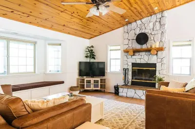 a living room with a couch and a fireplace at Namu Cabin in Big Bear Lake