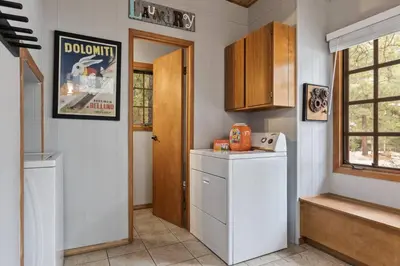 a kitchen with a washer and dryer in a room at The 99 Pines Walk to Snow Summit Hot Tub in Big Bear Lake