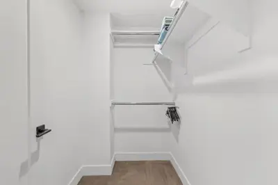 a bathroom with white walls and a stair case at Ruby Tide - Two Floor Airy 2BR Marina Side Exclusive Amenities in Los Angeles