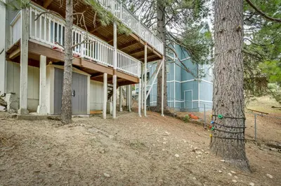 a building with a staircase on the side of it at The Abby Cabin Restful Running Springs Retreat! in Running Springs