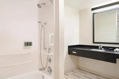 a bathroom with a shower and a sink at Fairfield Inn & Suites by Marriott Los Angeles LAX/El Segundo in El Segundo