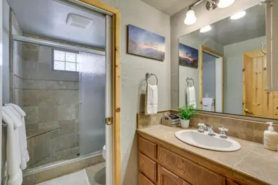 a bathroom with a sink and a shower at Central Big Bear Lake Retreat with Private Hot Tub! in Big Bear Lake
