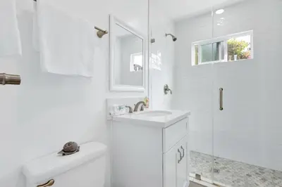a white bathroom with a sink and a shower at Modern Peaceful Private Oasis Near The Beach in Los Angeles