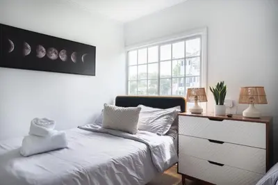 a bedroom with a bed and a dresser and a window at Angel&Rose Universal Hollywood Heated Pool House King Bed in Los Angeles