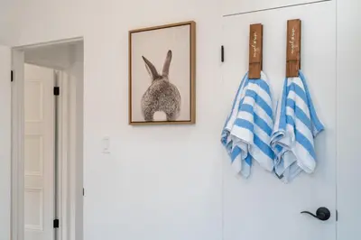 a picture of a rabbit hanging on a wall at Angel&Rose Universal Hollywood Heated Pool House King Bed in Los Angeles