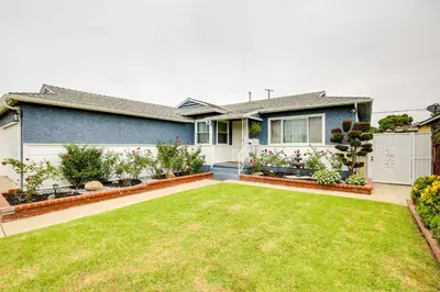 a house with a garden in front of it at Centrally Located Compton Retreat Patio and Grills in Compton
