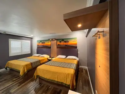 a room with two beds in a room at The Patio Motel - Los Angeles, LAX in Gardena