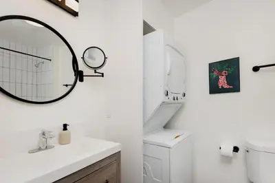 a white bathroom with a sink and a mirror at Fenix Hotel Hollywood in Los Angeles