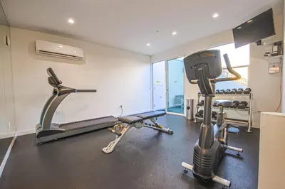 a gym with treadmills and a treadmill at Sunny & Spacious 2BDR & 1BTH in Downtown LA in Los Angeles