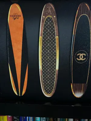 two skateboards are on a shelf with books at Chic Venice Beach Bungalow Steps from the Canals & Beach in Los Angeles
