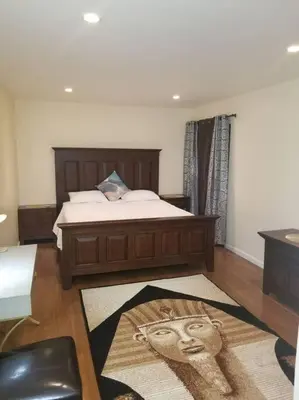 a bedroom with a bed with a face on it at Beautiful Spacious 2 Bedroom, 2 Bathroom Condo in Long Beach