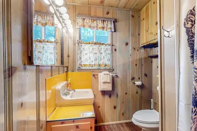 a bathroom with a sink and a toilet at El Sueńo in Crestline