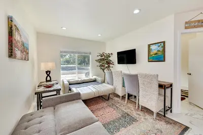 a living room with a couch and a table at Anaheim Hills Retreat - 17 Mi to Disneyland! in Anaheim