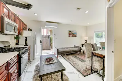 a kitchen and living room with a couch and a table at Anaheim Hills Retreat - 17 Mi to Disneyland! in Anaheim