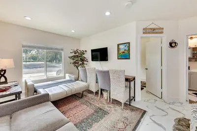 a living room with a couch and a table at Anaheim Hills Retreat - 17 Mi to Disneyland! in Anaheim