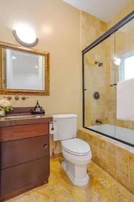 a bathroom with a toilet and a shower and a sink at Regal 4 bed with hot tub close to Universal sleeps 15 in Los Angeles