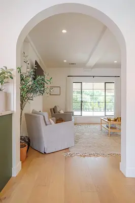 a living room with a white couch and a table at Designer 2 bed near Universal sleeps 8 hot tub in Los Angeles