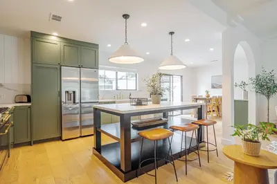 a kitchen with a large island with bar stools at Designer 2 bed near Universal sleeps 8 hot tub in Los Angeles