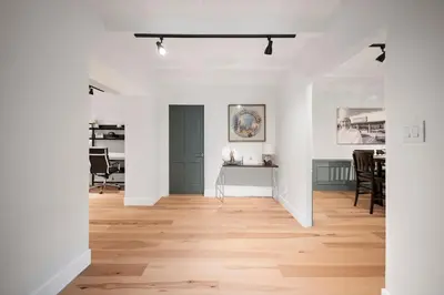 an open living room with white walls and wooden floors at Chic 3BR Oasis in Studio City:Toluca Lake Adjacent in Los Angeles