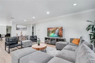 a living room with a couch and a table at Salt Water Pool Over Look Rocky Mountain View in Sierra Madre
