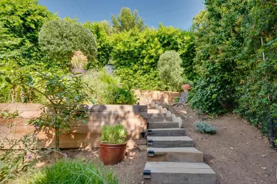 a garden with stone steps and plants and trees at Malibu Retreat with Balcony and Mountain Views in Malibu