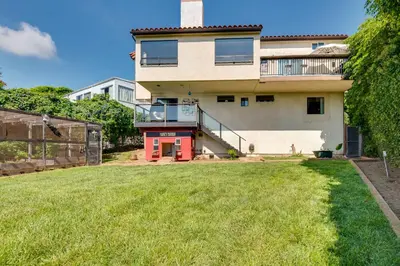 a house with a lawn in front of it at Malibu Retreat with Balcony and Mountain Views in Malibu