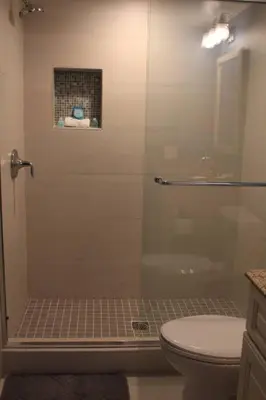 a bathroom with a glass shower with a toilet at MAGICAL Xcape, POOLS-SPA, WALK 2 DISNEY, CENTRAL AC-HEAT, FULLY EQUIPPED, 2 FREE PARKING SPACES, OWNER MGMT in Anaheim
