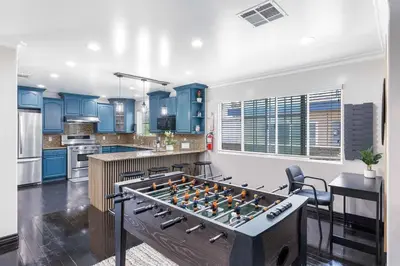 a kitchen with a foosball table in the middle of a room at Central Location Family Size Home in Temple City