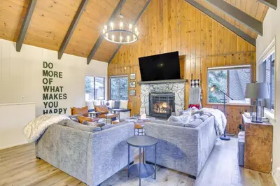 a living room with two couches and a fireplace at Cozy and Chic Lake Arrowhead Cabin with Deck! in Lake Arrowhead