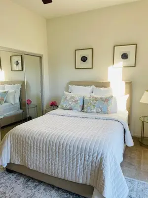 a bedroom with a large white bed with pillows at Private-room-Private-entrance-spectacular-city-landscape-views-from-room in Rancho Cucamonga