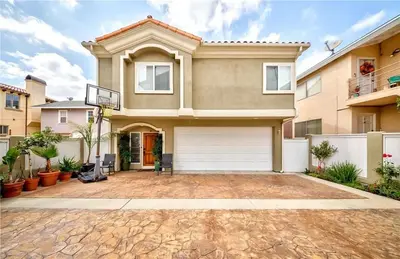 a large house with a garage at Redondo Beach Suite, 2 BR 1st floor Surf Gym workspace in Redondo Beach