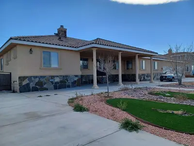 a house with a landscaping in front of it at Achievers in Palmdale
