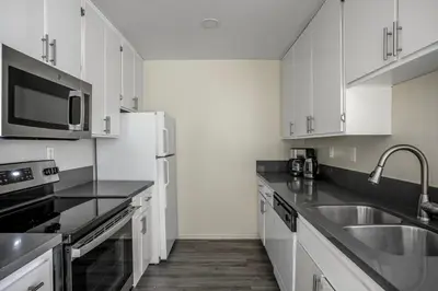 a white kitchen with a sink and a microwave at Westwood 1br close to UCLA LAX-1141 in Los Angeles