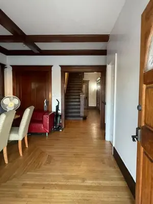 a living room with a red couch and wooden floors at Lovely Home at Westminster in Westminster
