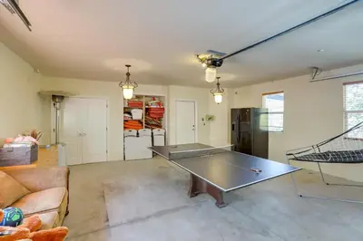 a living room with a ping pong table in it at Lake Arrowhead Home with 3 Decks and Stunning Views! in Lake Arrowhead